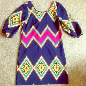 Aztec pattern dress with large bow back